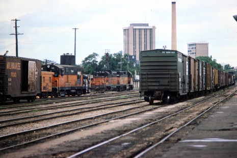 Milwaukee Road diesel locomotives and freight cars in the yard in Madison, Wisconsin, on Tuesday, June 29, 1976.  Photograph by Thomas F. McIlwraith, McIlwraith-01-031-19, © 2018, Center for Railroad Photography & Art, <a href="http://www.railphoto-art.org" rel="noreferrer nofollow">www.railphoto-art.org</a>