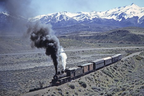 Viejo Expreso Patagónico (Old Patagonian Express) steam locomotive no. 4 leads passenger train past the kilometer post 30 in El Maitén, Chubut, Argentina, on October 15, 1990. Photograph by Fred M. Springer, © 2014, Center for Railroad Photography and Art, Springer-SOAM1-15-06