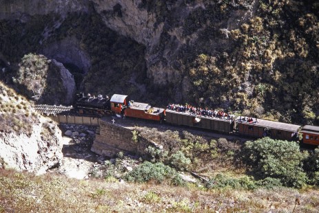En route to Huigra, Guayaquil-Quito Railway steam locomotive no. 45 leads a passenger train near Alausi, Chimborazo, Ecuador, on July 31, 1988. Photograph by Fred M. Springer, © 2014, Center for Railroad Photography and Art, Springer-ECU1-16-11
