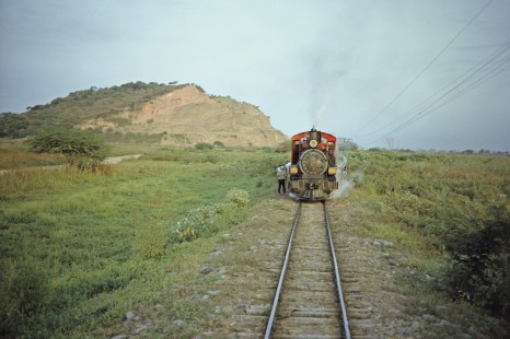 Guayaquil-Quito Railway steam locomotive no. 7 with freight train in Casiguana, Guayas, Ecuador, on July 8, 1990. Photograph by Fred M. Springer, © 2014, Center for Railroad Photography and Art, Springer-ECU1-21-36