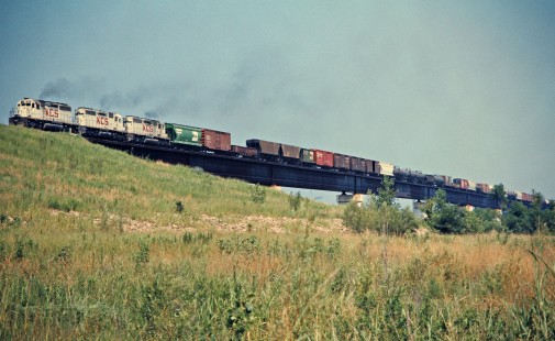 Southbound Kansas City Southern Railway freight train over Arkansas River in Spiro, Oklahoma, on July 17, 1977. Photograph by John F. Bjorklund, © 2016, Center for Railroad Photography and Art. Bjorklund-61-07-19