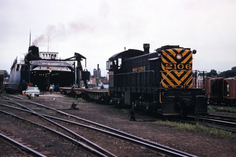 Soo Line Railway diesel switcher no. 2016 with idler cars loading the car ferry <i>City of Saginaw 31</i> on August 18, 1967, at Manitowoc, Wisconsin. Photograph by Thomas F. McIlwraith, McIlwraith-01-011-20, © 2018, Center for Railroad Photography & Art, <a href="http://www.railphoto-art.org" rel="noreferrer nofollow">www.railphoto-art.org</a>