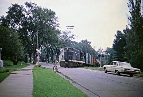 Illinois Central Railroad GP7 diesel locomotive no. 8851 leading a local freight train across Commonwealth Avenue in Madison, Wisconsin, on Friday, August 16, 1968. This line is now a bike path. Photograph by Thomas F. McIlwraith, © 2018, McIlwraith-01-024-02, Center for Railroad Photography & Art, <a href="http://www.railphoto-art.org" rel="noreferrer nofollow">www.railphoto-art.org</a>