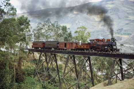 Guayaquil-Quito Railway steam locomotive no. 58 with a mixed passenger and freight train crossing the trestle at Alausi, Chimborazo, Ecuador, on July 10, 1990. Photograph by Fred M. Springer, © 2014, Center for Railroad Photography and Art, Springer-SOAM1-01-17