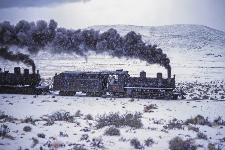 Viejo Expreso Patagónico (Old Patagonian Express) steam locomotive no. 6 leading a passenger train in the snow-covered Andes mountain range in Cerro Mesa, Río Negro, Argentina, on October 14, 1991. Photograph by Fred M. Springer. © 2014, Center for Railroad Photography and Art, Springer-PA-BR-SOAM-ME-ARG2-23-19