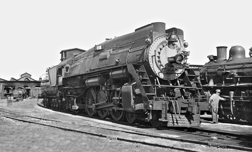 Southern Pacific Railroad shop scene at Sacramento, California, in June 1950. Mechanic seems to be draining air from 0-6-0, while Pacific no. 2484 awaits a call. Photograph by J. Parker Lamb, © 2016, Center for Railroad Photography and Art. Lamb-02-022-03