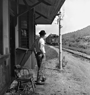 Tennessee Central Railway operator at depot in Silver Point, Tennessee, has signaled OK to conductor of eastbound train in June 1962. Photograph by J. Parker Lamb, © 2016, Center for Railroad Photography and Art. Lamb-02-025-02