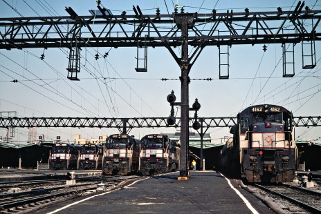 Conrail (ex-Erie Lackawanna) commuter passenger train lineup at Hoboken, New Jersey, on May 8, 1981. Photograph by John F. Bjorklund, © 2015, Center for Railroad Photography and Art. Bjorklund-57-17-20