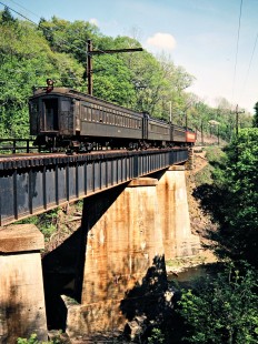Westbound Conrail (ex-Erie Lackawanna) commuter passenger train on bridge in Millington, New Jersey, on May 9, 1981. Photograph by John F. Bjorklund, © 2015, Center for Railroad Photography and Art. Bjorklund-57-23-04
