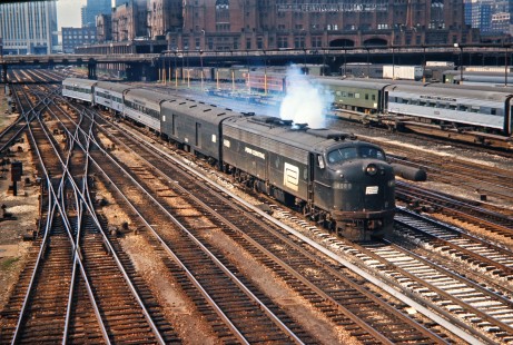 Amtrak passenger train no. 356 operating on Penn Central track leaving Union Station in Chicago, Illinois, for Detroit, Michigan, with E-unit no. 4080 on July 4, 1971. Photograph by John F. Bjorklund, © 2016, Center for Railroad Photography and Art. Bjorklund-79-08-10