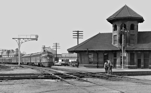 Frisco Lines' <i>Kansas City-Florida Special</i> passenger train pulls into the station at Tupelo, Mississippi. Train is en route from Memphis, Tennessee, to Birmingham, Alabama, in March 1954. Crossing line is Gulf, Mobile and Ohio Railroad to Jackson, Tennessee (to right). Photograph by J. Parker Lamb, © 2016, Center for Railroad Photography and Art. Lamb-02-001-03