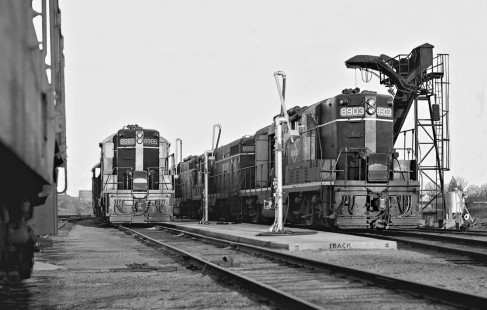 The sun is setting on two sets of road power at joint Illinois Central Railroad-Southern Railway yard in Meridian, Mississippi, in August 1952. With IC's switch to diesels, the ash pit conveyer (right) will soon come down. Photograph by J. Parker Lamb, © 2016, Center for Railroad Photography and Art. Lamb-02-014-11