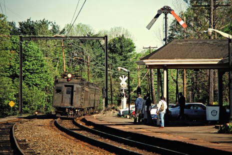 Eastbound Conrail (ex-Erie Lackawanna) commuter passenger train nearing station in Millington, New Jersey, on May 7, 1981. Photograph by John F. Bjorklund, © 2015, Center for Railroad Photography and Art. Bjorklund-57-28-06