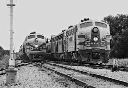 Repainted F-units power northward Atchison, Topeka and Santa Fe Railway <i>Texas Chief</i> passenger train in months before Amtrak. Here it passes a freight train near th estation in Temple, Texas, in July 1971. Photograph by J. Parker Lamb, © 2016, Center for Railroad Photography and Art. Lamb-02-067-04