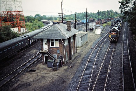 Northbound Louisville and Nashville Railroad freight train passing passenger excursion pulled by Nickel Plate Road steam locomotive no. 765 at Winchester, Kentucky, on September 3, 1984. Photograph by John F. Bjorklund, © 2016, Center for Railroad Photography and Art. Bjorklund-71-13-08