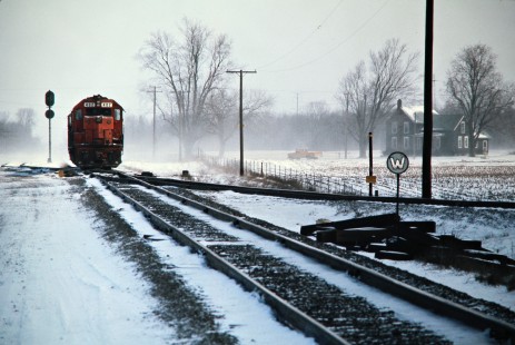 Detroit, Toledo and Ironton Railroad freight train on Ann Arbor track at Diann Tower in Dundee, Michigan, on March 24, 1974. Photograph by John F. Bjorklund, © 2016, Center for Railroad Photography and Art. Bjorklund-50-10-15