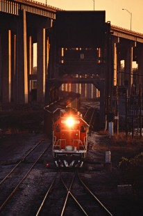 Grand Trunk Western Railroad freight train in Detroit, Michigan, northbound over the Rouge River bridge at Delray on April 28, 1985. Photograph by John F. Bjorklund, © 2016, Center for Railroad Photography and Art. Bjorklund-59-02-13