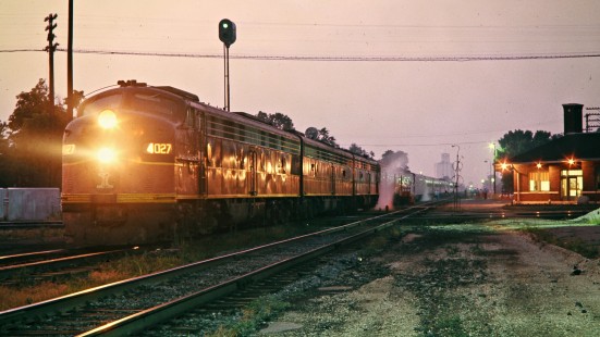 Illinois Central Railroad E9 diesel locomotive no. 4027, leading an A-B-A set on passenger train no. 59, the <i>Panama</i>, at dusk in Effingham, Illinois, in June 1972. Photograph by John F. Bjorklund, © 2016, Center for Railroad Photography and Art. Bjorklund-60-04-13