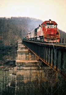 Eastbound Western Maryland Railway freight train crossing the Youghiogheny River in Ohiopyle, Pennsylvania, on March 21, 1975. Photograph by John F. Bjorklund, © 2016, Center for Railroad Photography and Art. Bjorklund-92-02-12