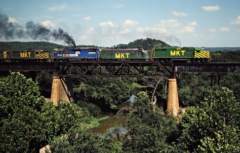 Southbound Missouri–Kansas–Texas Railroad freight train over Muddy Boggy Creek in Atoka, Oklahoma, on July 16, 1981. Photograph by John F. Bjorklund, © 2016, Center for Railroad Photography and Art. Bjorklund-70-15-01