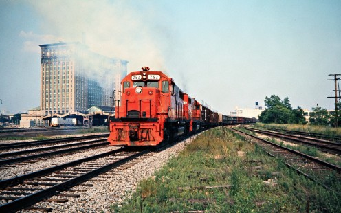 Westbound Detroit, Toledo and Ironton Railroad freight train on Conrail at the Michigan Central Station in Detroit, Michigan, on June 24, 1976. Photograph by John F. Bjorklund, © 2016, Center for Railroad Photography and Art. Bjorklund-50-28-05