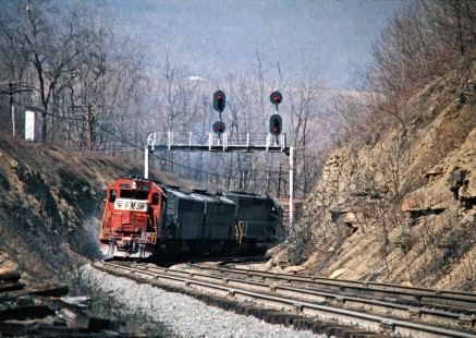 Westbound Western Maryland Railway freight train in Mount Savage, Maryland, on March 23, 1975. Photograph by John F. Bjorklund, © 2016, Center for Railroad Photography and Art. Bjorklund-92-06-10