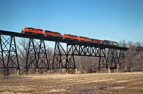 Southbound Detroit, Toledo and Ironton Railroad freight train crossing bridge in Quincy, Ohio, on March 22, 1980. Photograph by John F. Bjorklund, © 2016, Center for Railroad Photography and Art. Bjorklund-51-29-20