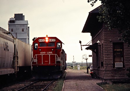 Eastbound Soo Line Railroad freight train at station in Wishek, North Dakota, on July 7, 1980. Photograph by John F. Bjorklund, © 2016, Center for Railroad Photography and Art. Bjorklund-83-13-16