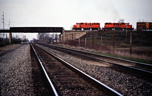 Northbound Detroit, Toledo and Ironton Railroad freight train crossing the Conrail main line in Delta, Ohio, on May 6, 1979. Photograph by John F. Bjorklund, © 2016, Center for Railroad Photography and Art. Bjorklund-51-19-02