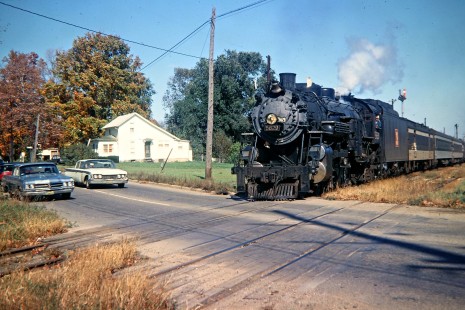 Grand Trunk Western Railroad in Stockbridge, Michigan. GTW excursion sponsored by Mid RR Club to Jackson, Michigan, with ex-GTW steam locomotive no. 5629 crossing Main St. in October 1968. Photograph by John F. Bjorklund, © 2016, Center for Railroad Photography and Art. Bjorklund-58-05-24