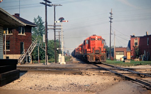 Detroit, Toledo and Ironton Railroad freight train picking orders on the fly at Carleton, Michigan, in September 1968. Photograph by John F. Bjorklund, © 2016, Center for Railroad Photography and Art. Bjorklund-50-01-14