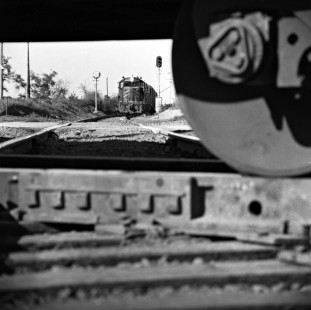 Southbound Missouri Pacific Railroad freight train waits for Southern Pacific Railroad local train to clear McNeil, Texas, crossing in May 1975. Photograph by J. Parker Lamb, © 2016, Center for Railroad Photography and Art. Lamb-02-064-04