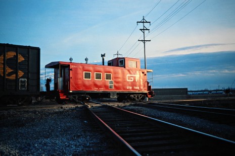 Eastbound Grand Trunk Western Railroad caboose in Flint, Michigan, on April 8, 1978. Photograph by John F. Bjorklund, © 2016, Center for Railroad Photography and Art. Bjorklund-58-21-06