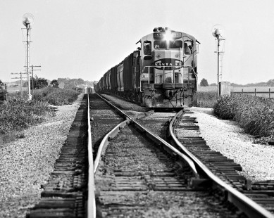 Southbound Atchison, Topeka and Santa Fe Railway freight train pulls back onto mainline after a meet south of Brenham, Texas, in July 1975. Photograph by J. Parker Lamb, © 2016, Center for Railroad Photography and Art. Lamb-02-067-12