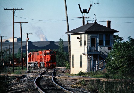 Westbound Detroit, Toledo and Ironton Railroad freight train at Tower FN in Trenton, Michigan, on June 3, 1976. Photograph by John F. Bjorklund, © 2016, Center for Railroad Photography and Art. Bjorklund-50-24-16