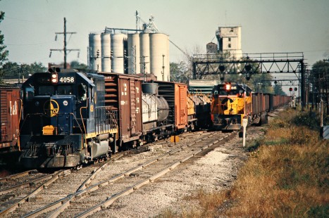 Two southbound Baltimore and Ohio Railroad freight trains in Deshler, Ohio, on September 28, 1975. Photograph by John F. Bjorklund, © 2016, Center for Railroad Photography and Art. Bjorklund-92-16-18