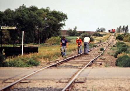 Eastbound Soo Line Railroad freight train approaches a track crew working at Braddock, North Dakota, on July 8, 1980. Photograph by John F. Bjorklund, © 2016, Center for Railroad Photography and Art. Bjorklund-83-12-20