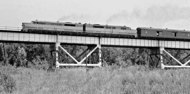 Sleek PA locomotives lead westbound Southern Pacific Railroad <i>Argonaut</i> passenger train over Huey P. Long Bridge in New Orleans, Louisiana, in August 1953. Photograph by J. Parker Lamb, © 2016, Center for Railroad Photography and Art. Lamb-02-057-05