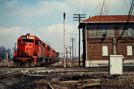 Southbound Detroit, Toledo and Ironton Railroad freight train at crossing in Hamler, Ohio, on March 15, 1980. Photograph by John F. Bjorklund, © 2016, Center for Railroad Photography and Art. Bjorklund-51-26-05