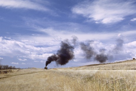 Smoke from the Union Pacific Railroad’s famous steam locomotive no. 844 (temporarily renumbered to 8444 at the time of this photograph) mingles with the clouds that sweep through a dramatic western sky in the high plains of Colorado. Photograph by Fred M. Springer, © 2016, Center for Railroad Photography and Art. Springer-CO2-10-32