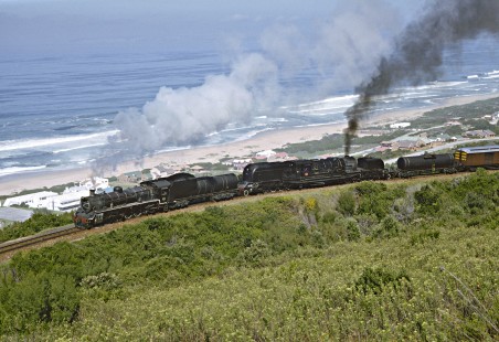 Two South African Railways steam locomotives lead a special passenger train along the Indian Ocean on March 22, 1995 © 2015, Center for Railroad Photography and Art. Springer-So.Africa(1)-14-13