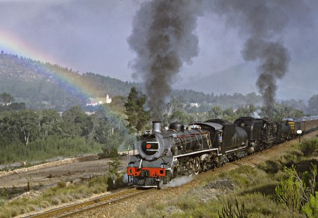 Steam locomotives are the pot of gold at the end of this rainbow in Camfer, South Africa, on March 23, 1995. Photograph by Fred M. Springer, © 2016, Center for Railroad Photography and Art. Springer-So.Africa(1)-16-10