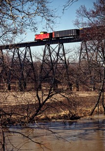 Caboose of a northbound Detroit, Toledo and Ironton Railroad freight train on the bridge in Quincy, Ohio, on April 5, 1980. Photograph by John F. Bjorklund, © 2016, Center for Railroad Photography and Art. Bjorklund-51-30-12