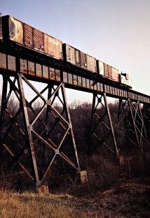 Caboose of an eastbound Soo Line Railroad freight train crossing a bridge near South Haven, Minnesota, on April 17, 1981. Photograph by John F. Bjorklund, © 2016, Center for Railroad Photography and Art. Bjorklund-83-17-20