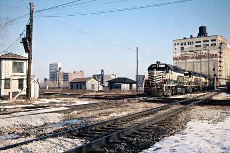 Illinois Central Gulf Railroad freight train (led by locomotives of predecessor Gulf, Mobile and Ohio) at 16th Street crossing in Chicago, Illinois, on February 1983. Photograph by John F. Bjorklund, © 2016, Center for Railroad Photography and Art. Bjorklund-60-18-22