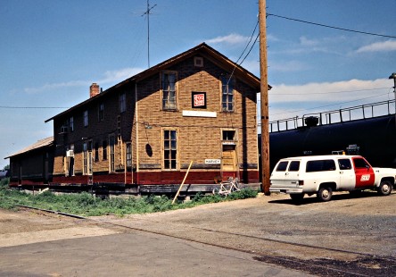 Soo Line Railroad depot and company truck at Harvey, North Dakota, on July 5, 1980. Photograph by John F. Bjorklund, © 2016, Center for Railroad Photography and Art. Bjorklund-83-04-08