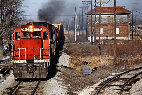 Southbound Detroit, Toledo and Ironton Railroad freight train  at Baltimore and Ohio crossing in Hamler, Ohio, on January 11, 1986. Photograph by John F. Bjorklund, © 2016, Center for Railroad Photography and Art. Bjorklund-52-24-04