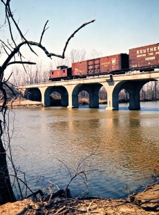 Northbound Detroit, Toledo and Ironton Railroad freight train at River Raisin in Dundee, Michigan, on April 15, 1973. Photograph by John F. Bjorklund, © 2016, Center for Railroad Photography and Art. Bjorklund-50-06-04
