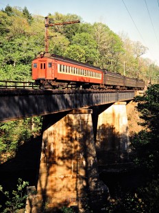 Westbound Conrail (ex-Erie Lackawanna) commuter passenger train crossing bridge in Millington, New Jersey, on May 7, 1981. Photograph by John F. Bjorklund, © 2015, Center for Railroad Photography and Art. Bjorklund-57-11-16