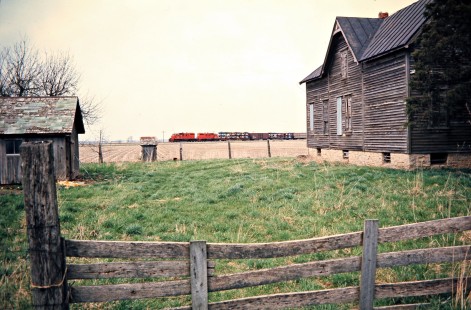 Southbound Detroit, Toledo and Ironton Railroad freight train passing through the countryside at Riga, Michigan, on April 27, 1974. Photograph by John F. Bjorklund, © 2016, Center for Railroad Photography and Art. Bjorklund-50-12-16
